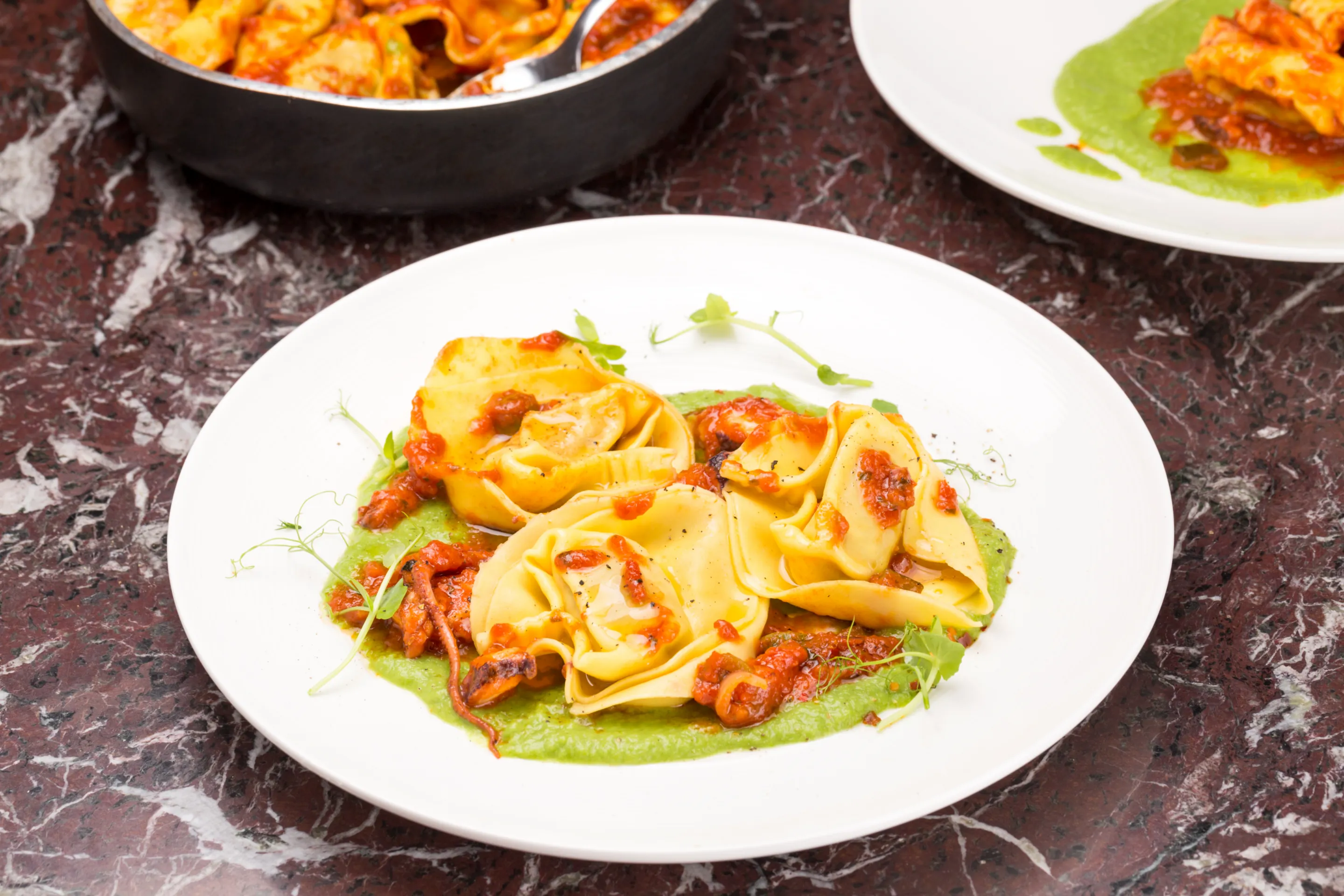 Tortelli ai fagiolini con polpo al pomodoro