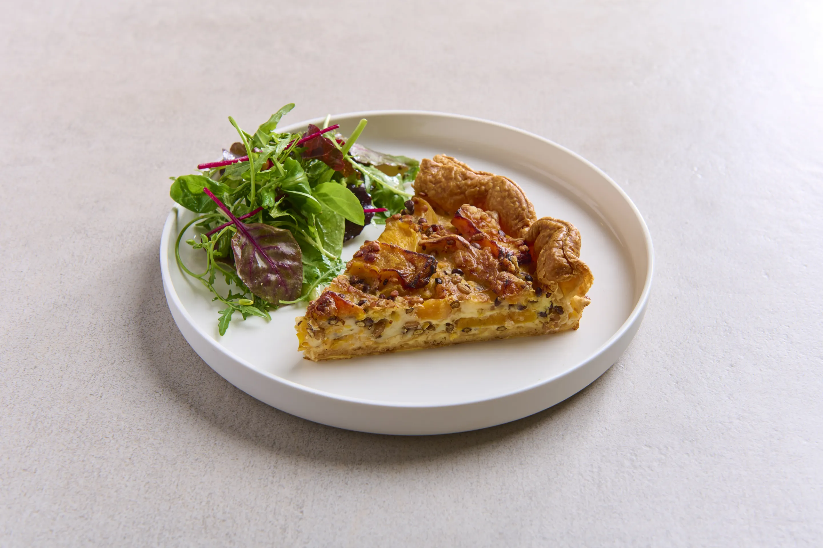 Quiche met gegrilde pompoen en linzen